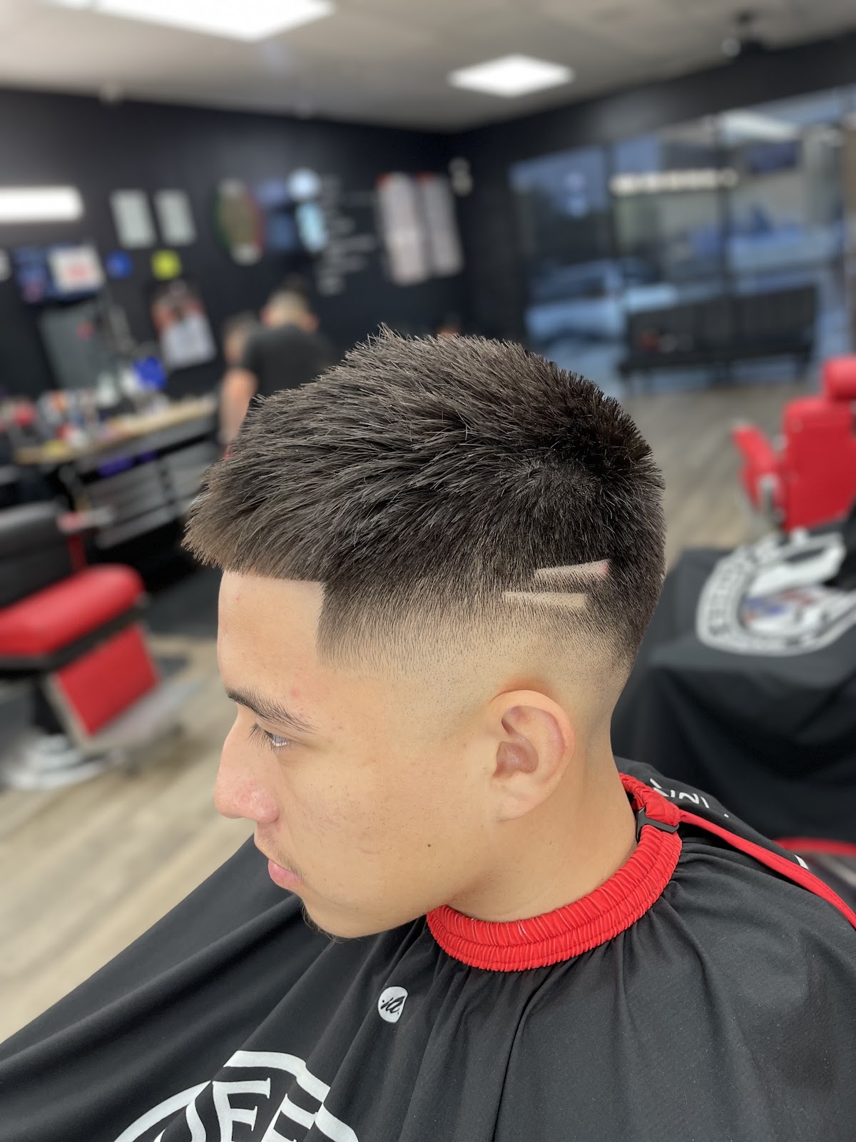 Sharp taper fade with design line on side